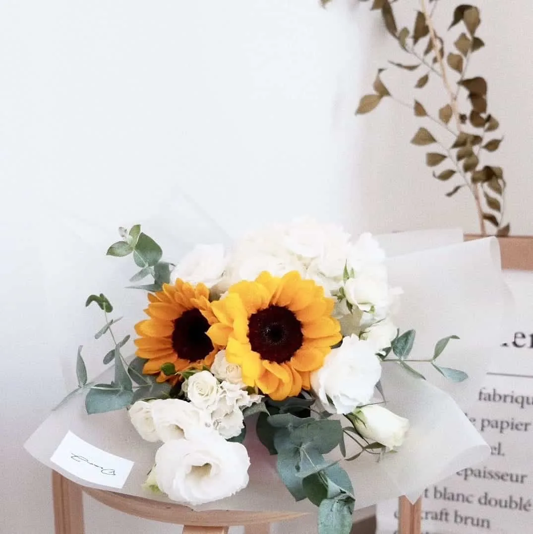 Sunflowers, White Hydrangea, White Eustoma, Spray Roses and Eucalyptus.