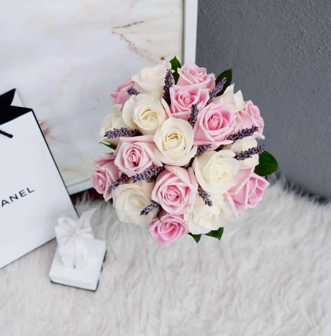 21 Pink and White Roses, Lavender and Ruscus leaves, tied with white ribbon.