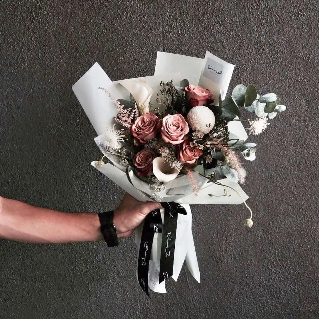 Kenya Cappuccino Rose, Calla Lilies, Queen Anne Lace, Ping Pong, Astrantia, Astilbe, Pennisetum and filler leaves.