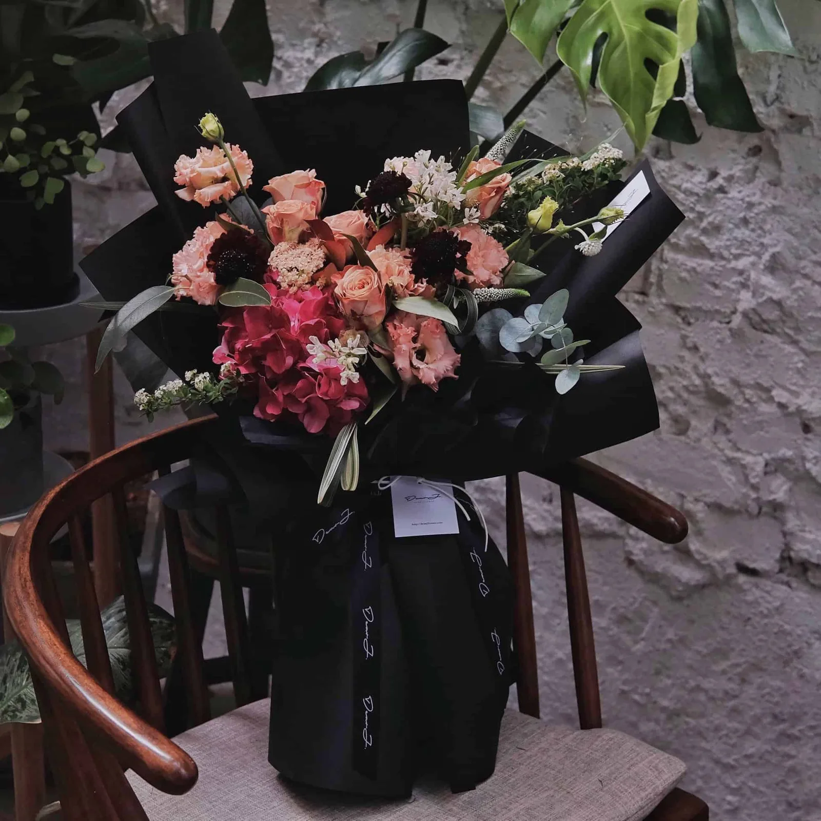 Hydrangea, Vintage Cappuccino Roses, Eustoma, Veronica, Bear Grass, Panicum and Eucalyptus.